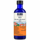 Eine blaue glasflasche mit schwarzem verschluss und weißem etikett mit blumenmotiven nimi vata bio massageöl 200ml