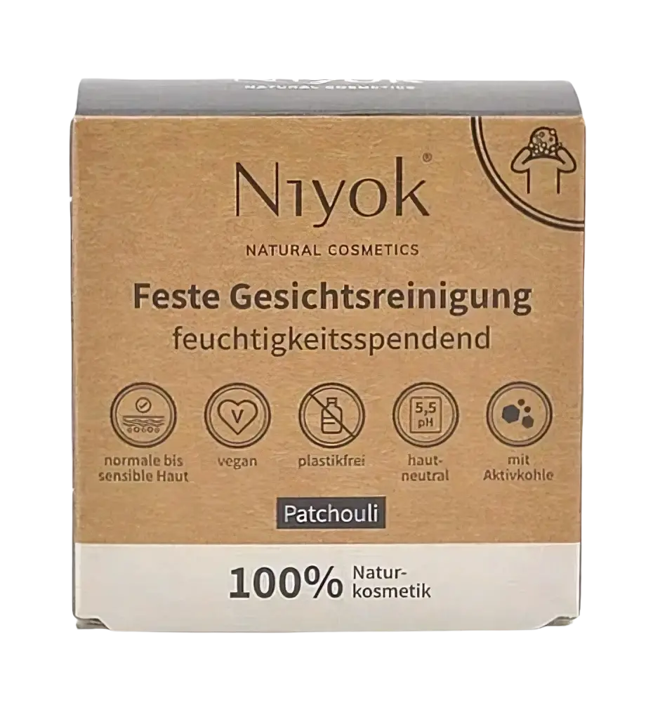 Feste Gesichtsreinigung mit Patchouli von Niyok, 80g, zeigt die natürliche Textur und Verpackung des Produkts