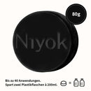 Feste Gesichtsreinigung mit Patchouli von Niyok, 80g, zeigt die natürliche Textur des Reinigungs-Patches in der Verpackung