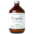Braune glasflasche mit silberkappe und weißem etiket mit niyok mundspülung pfefferminze 500 ml