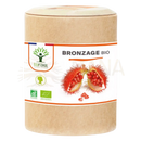 Ein brauner zylindrischer karton mit weißem etikett organische bräunung kapseln mit organic urucum von mana shop
