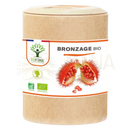 Ein brauner zylindrischer karton mit organic urucum kapseln und weißem etikett für organische bräunung von bioptimal