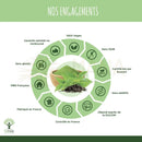 Ein hölzerner schüssel mit grünem tee matcha pulver und frischen teeblättern für organisches gewichtsverlust