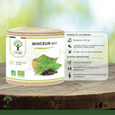Ein zylindrischer behälter der bioptimal minceur bio gewichtverlust ergänzung mit naturbeigem deckel und grünem tee bild