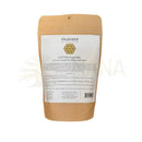 Braune papiertüte mit paavani ayurveda baumwollflanell für wiederverwendbare ayurvedisches rizinusölwickel