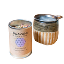A cylindrical tin of paavani ayurveda bliss blend balancing tridose tea with kraft paper label and purple design for emotionale balance