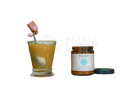 A glass jar of paavani ayurveda pitta spice blend with blue geometric label and amber contents from mana shop