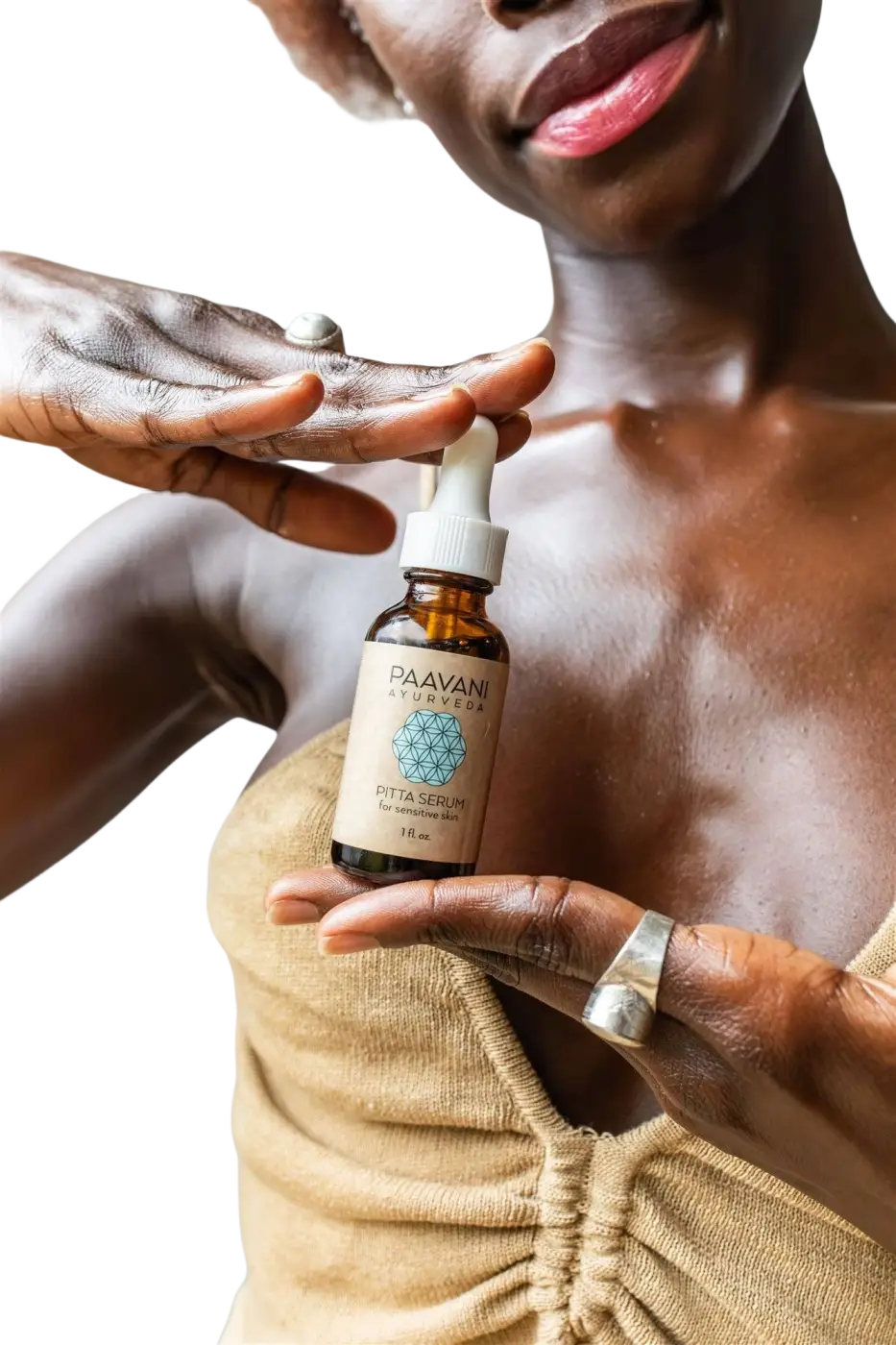Kleine bernsteinfarbene glasflasche mit weißem tropfverschluss und beige etikett paavani ayurveda pitta serum für empfindliche haut ayurvedisches gesichtsöl