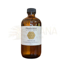 Braune glasflasche paavani ayurveda eranda taila mit schwarzem schraubverschluss und weißem etikett ayurvedisches mehrzwecköl