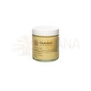 A paavani ayurveda trataka ghee candle in a clear glass jar with pale yellow wax for ayurvedic meditation