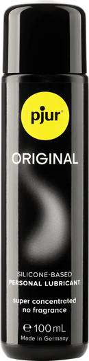 Schwarze zylindrische flasche pjur original silikonbasierter gleitmittel 100 ml mit gelbem logo und weißem text