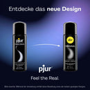 Schwarze zylindrische pjur original flasche mit silbernem verschluss und gelbem logo original silikonbasierter gleitmittel