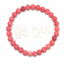 Rhodonit-Armband aus rosa Edelsteinen, handgefertigtes Schmuckstück, zeigt polierte Rhodonit-Steine auf einem elastischen Band.