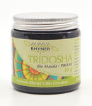 Braunes Glas mit silbernem Schraubverschluss, beschriftet mit Ayurveda Rhyner Tridosha Bio Masala - Pikant, 50g.