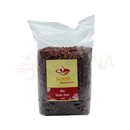 Eine 500g packung bio roter kattuyanam ayurveda vollkornreis von mohini im klaren plastikbeutel mit gelb rotem etikett