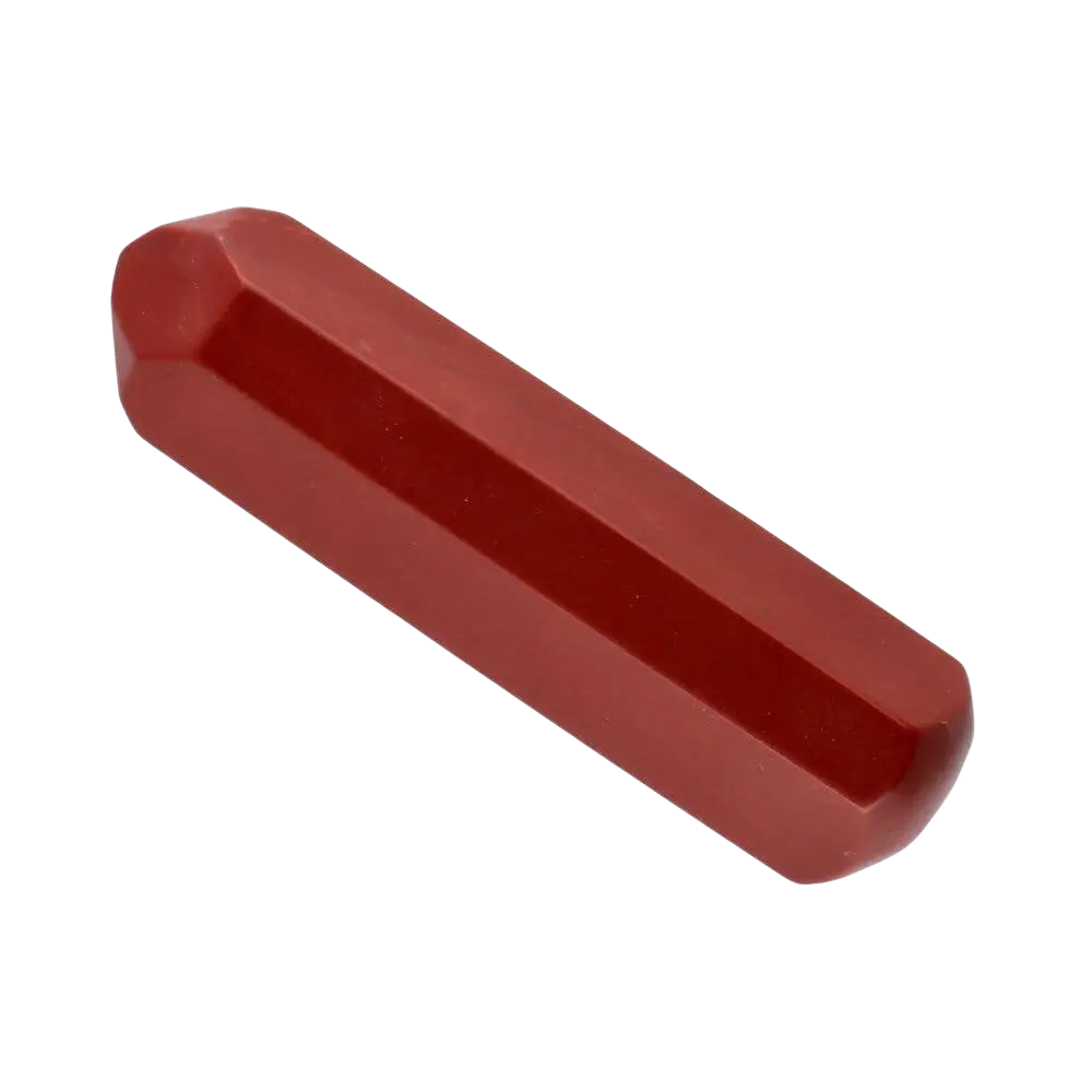 Roter jasper massager in facettierter oktagonalform mit polierter glatter oberfläche zur gesichtsmassage
