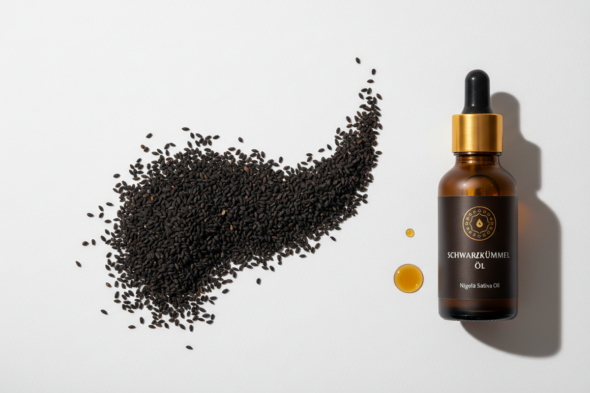 Schwarzkümmel Öl Nigella Sativa in Braunglasflasche mit Tropfer und schwarzen Samen.