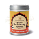 Ein zylinderförmiges bio-glas schwarzkümmelsamen mit gelb-rotem etikett für agni queen spice und digestive fire