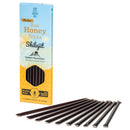 Dark amber honey sticks with shilajit in a vibrant blue and yellow siberiangreen box for natural energy from mana shop
