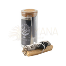 A sage smudge stick with gray charred leaves tied by black string and a natural wood palo santo base for energetische reinigung in a spirituelles geschenkset
