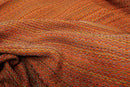 Mehrfarbiges orangefarbenes Hamamtuch von Stefano Ferrante, 100x180cm, mit buntem Muster und weicher Textur.