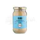 Ein klares glasgefäß mit goldverschluss enthält triphala churna von nimi ayurveda als beige puder 250g für trockene massage mana shop