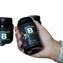 Schwarzes plastikglas fels supreme vitamin b komplex mit grünem schriftzug und blattlogo enthält 60 kapseln für gesunde haut und gehirnfunktion