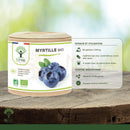 Ein zylindrischer behälter wilde bio blaubeere bio blaubeere myrtille kapseln mit holzdeckel zur unterstützung der augengesundheit und freie radikale