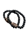 Schwarzes beaded armband mit zwei braun-weißen tigerauge perlen aus recycelter knochenperle und nepalesischer handwerkskunst