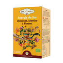 Bio-Kräutertee Fire Energy von Zen'Arôme mit Schokolade, Minze und Chili, in einer Tasse mit Kräutern und Teeblättern.