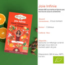 Zen'Arôme Bio-Kräutertee Joie Infinie mit Kakao, Kardamom und Orangennote in einer Tasse, mit Teeblättern und Gewürzen.