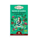 Bio-Kräutertee Zen'Arôme Spirale de Lumière mit frischen Kräutern in einer transparenten Tasse, belebende Infusion, natürliche Zutaten.