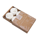 White circular zen shower steamers with dried lavender in kraft box labeled mood boost shower steamers for relaxation
