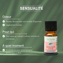Kleine bernsteinfarbene glasflasche mit schwarzem deckel und pinkem label der marke zen arome ätherische öl-synergie sensualität für momente der freude