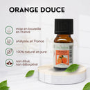 Kleine bernsteinfarbene glasflasche mit schwarzem kupplung und weißem etikett zen arôme süßorangenöl 10 ml für kaltdiffusion und kaltpressung