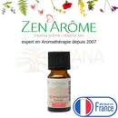 Kleine bernsteinfarbene glasflasche mit schwarz gerilltem deckel und weißem label zen arome revitalisante synergie belebende ätherische öl-mischung für natürliche ätherische öle zur raumatmosphäre