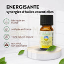 Kleine bernsteinfarbene glasflasche mit schwarzem deckel und gelbem label zen arôme belebendes ätherisches öl ohne terpenentfernung