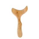 Light brown madérothérapie wooden massager with smooth curved whale tail design from mana shop for body shaping and detox