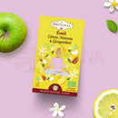 Gelbe rechteckige box shottimaa éveil organic awakening kräutertee mit zitrone apfel ingwer und meditierender figur