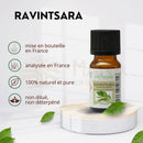Kleine bernsteinfarbene glasflasche mit schwarzem deckel und weißem etikett zen arome ravintsara ätherisches öl 100 % natürlich ideal bei erkältung