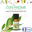 Kleine bernsteinfarbene glasflasche mit schwarzem deckel und weißem label von zen arome ravintsara ätherisches öl ideal bei erkältung
